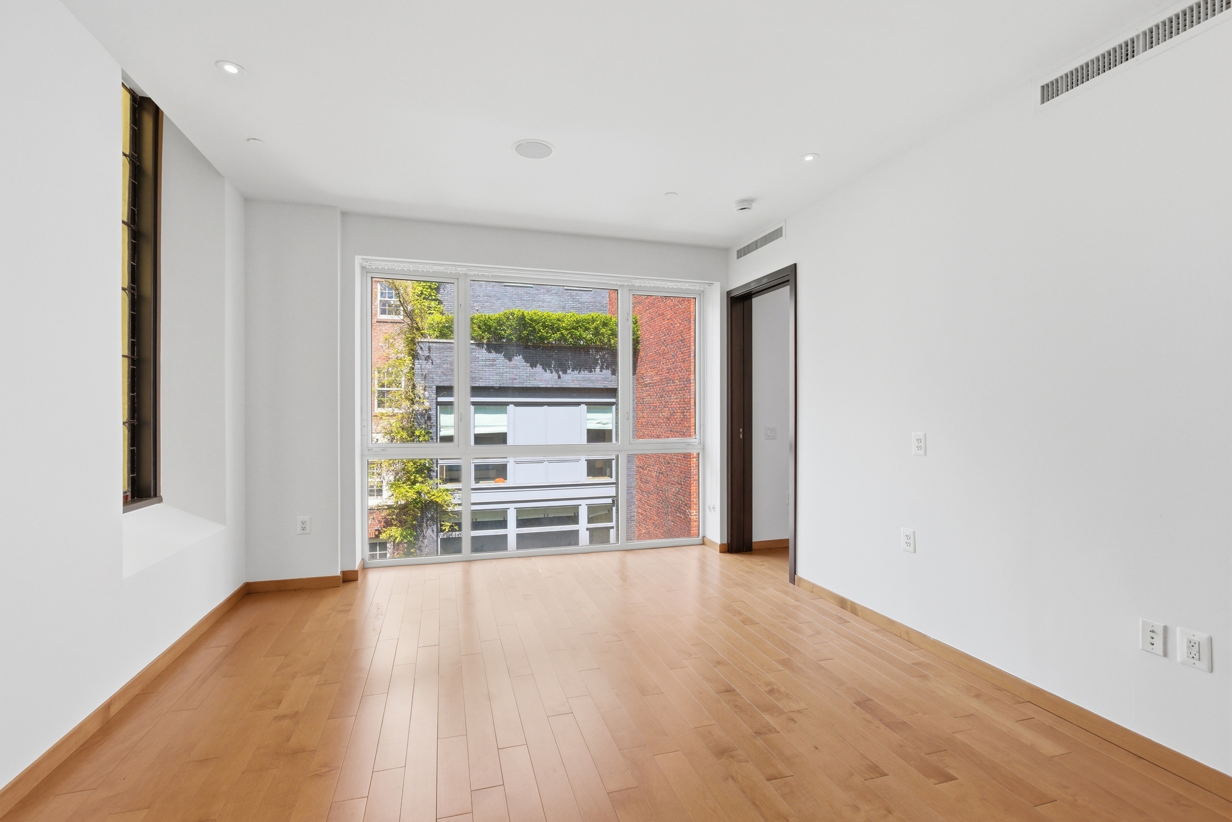 135 West 4th Street, Unit 3W Manhattan, NY 10012 - Photo 7 of 24 a view of an empty room with a window