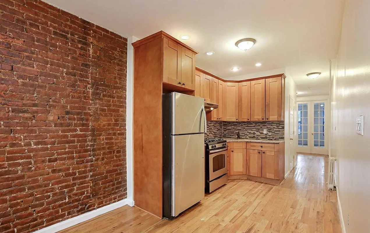 477 Hicks Street, Unit 2R Brooklyn, NY 11231 - Photo 3 of 7 a kitchen with stainless steel appliances granite countertop a refrigerator and a stove