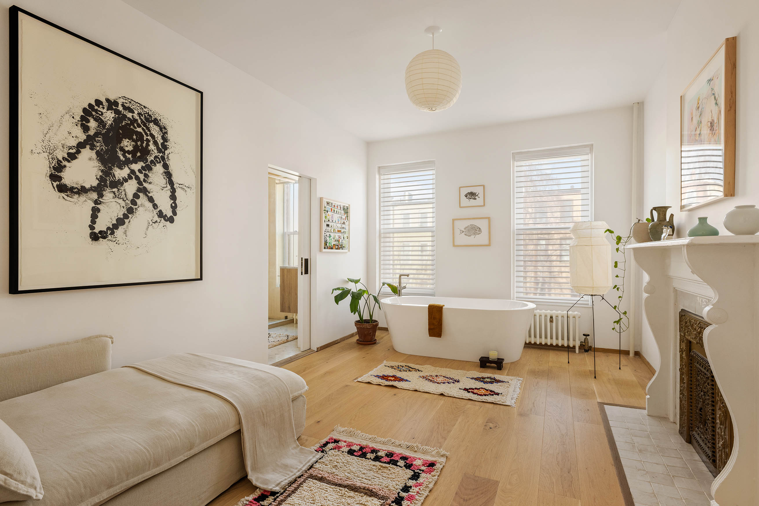 679 Putnam Avenue Brooklyn, NY 11221 - Photo 10 of 27 a bedroom with a bed and wooden floor