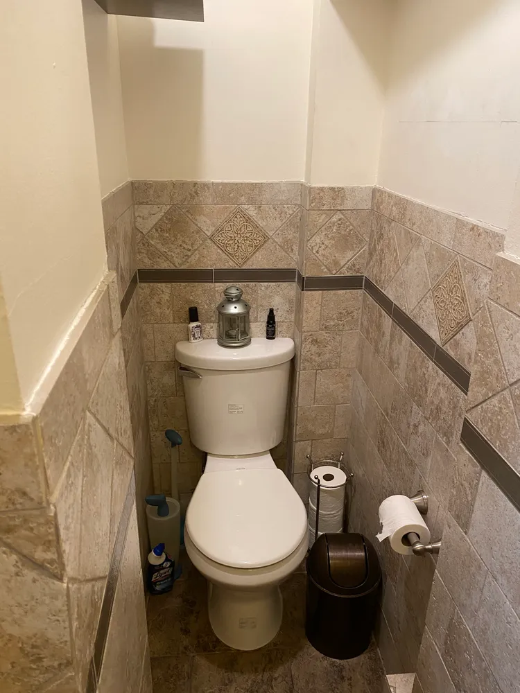 a bathroom with a toilet and a sink