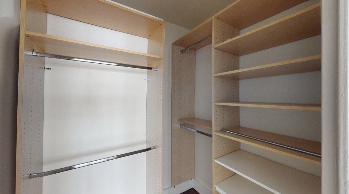 220 East 63rd Street, Unit 4N Manhattan, NY 10065 - Photo 8 of 13 a view of walk in closet with empty racks