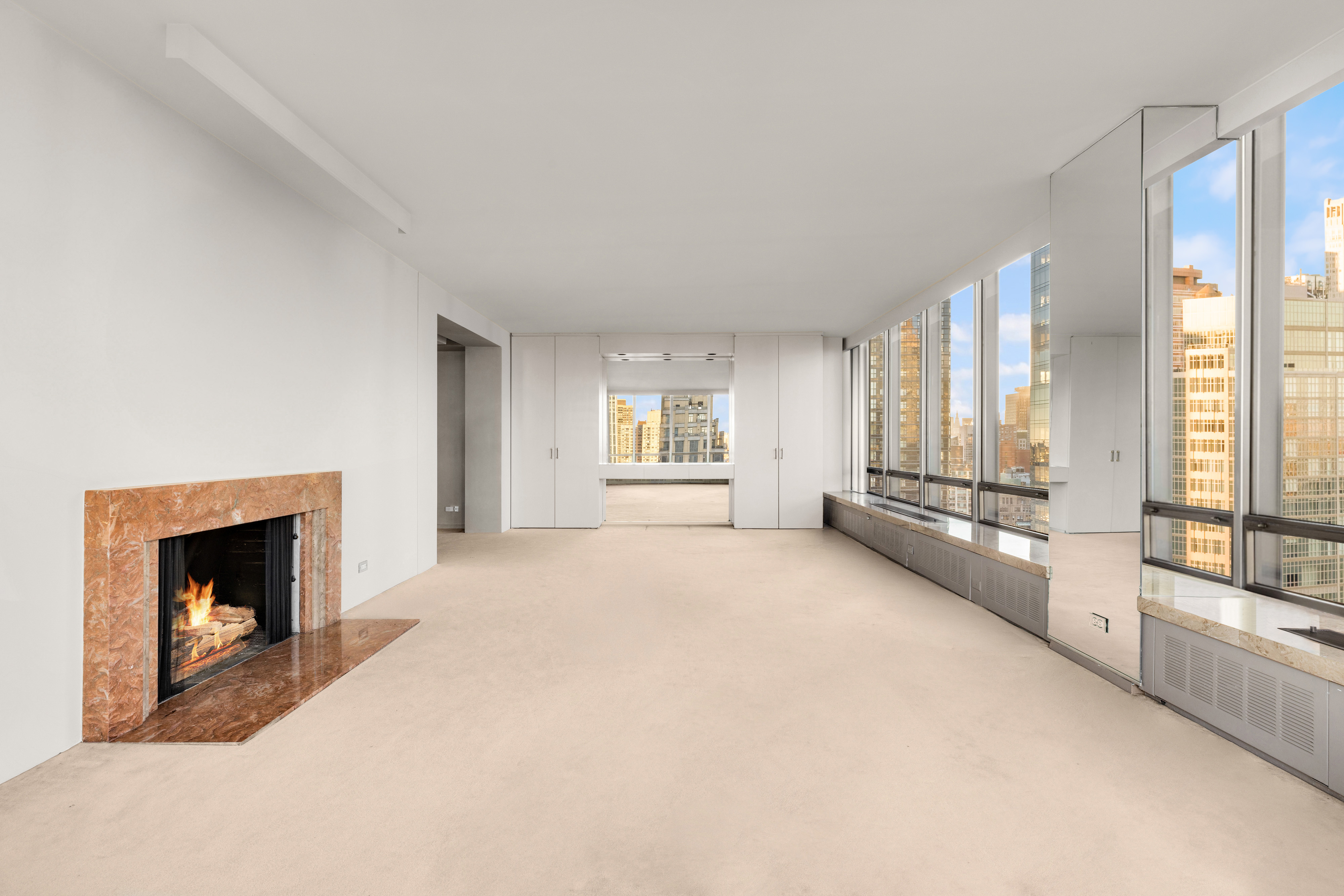 860 United Nations Plaza, Unit 36D Manhattan, NY 10017 - Photo 5 of 21 a view of an empty room with large windows