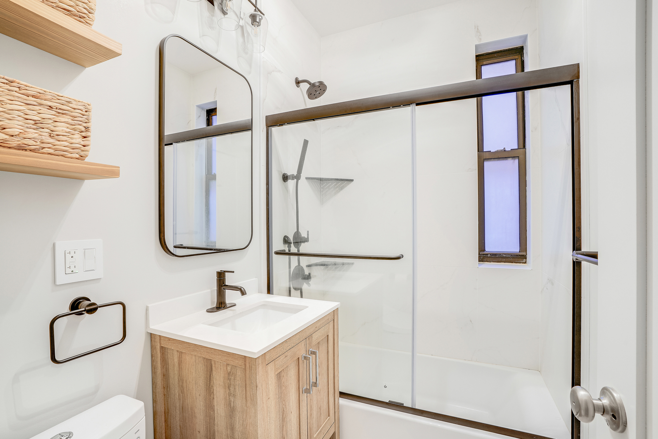 129 West 89th Street, Unit 36 Manhattan, NY 10024 - Photo 11 of 14 a bathroom with a sink and a mirror