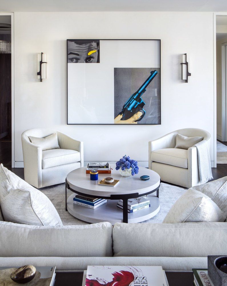 20 West 53rd Street, Unit 42A Manhattan, NY 10019 - Photo 9 of 31 a living room with furniture and a couch