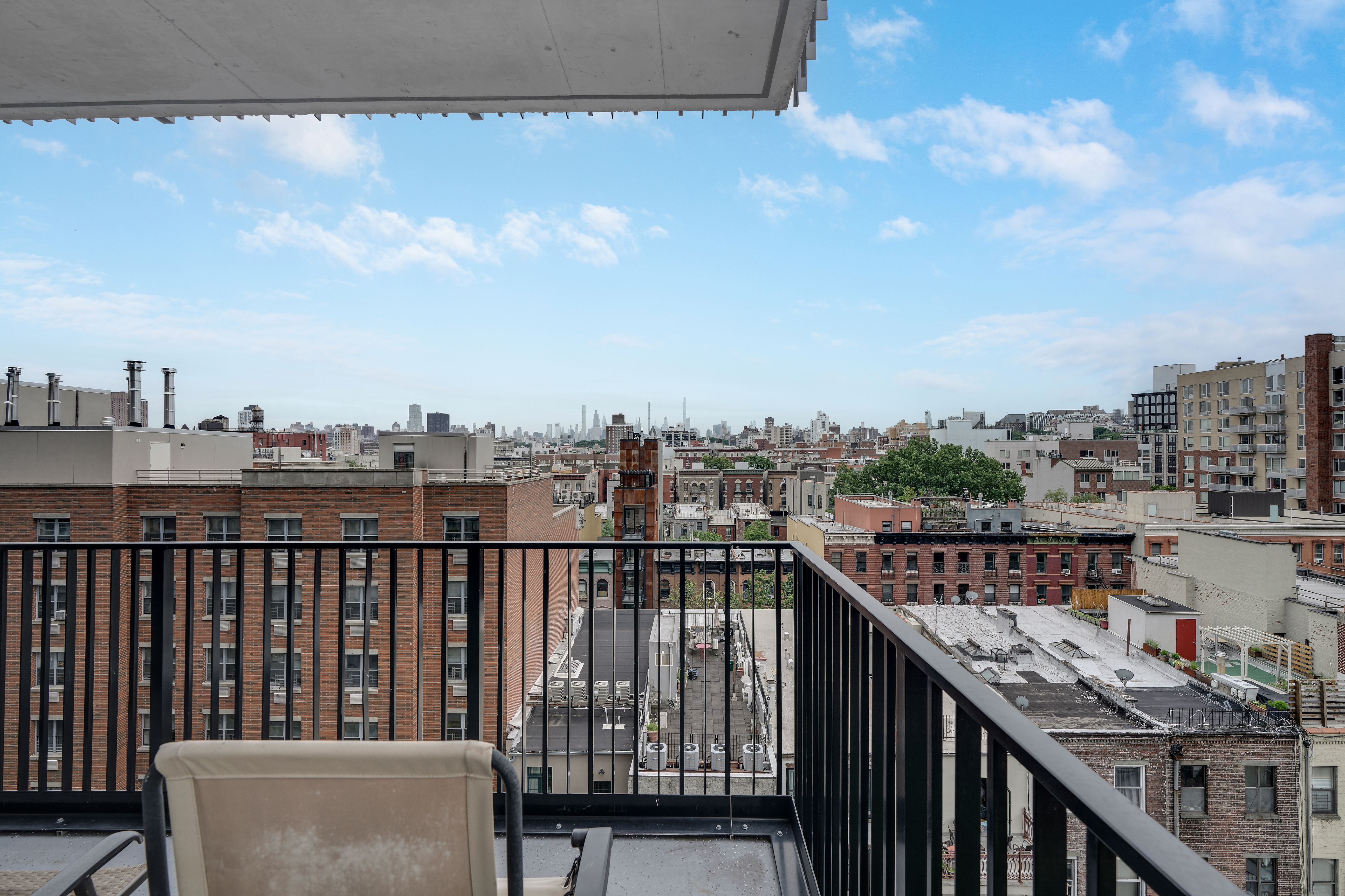 224 West 124th Street, Unit 305 Manhattan, NY 10027 - Photo 6 of 23 a view of city from balcony