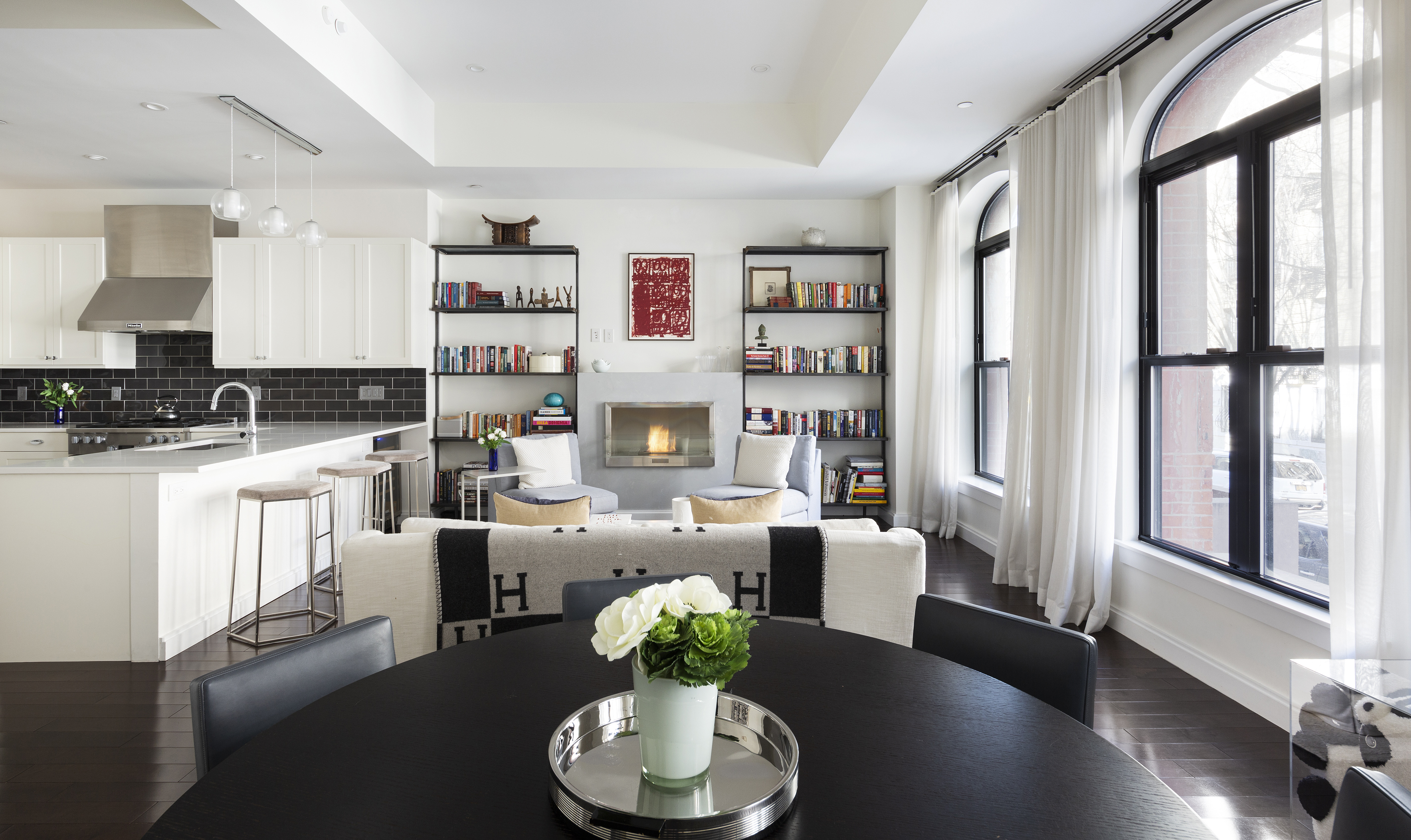 320 West 115th Street Manhattan, NY 10026 - Photo 2 of 11 a living room with furniture and a wooden floor