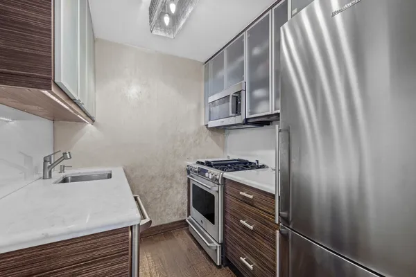a kitchen with a stove and a sink