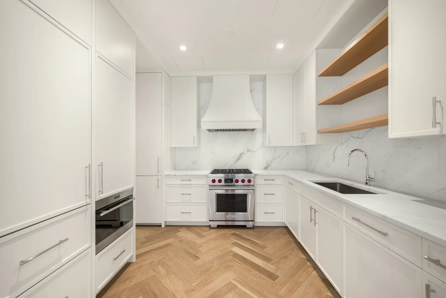 a kitchen with stainless steel appliances granite countertop a stove and a sink