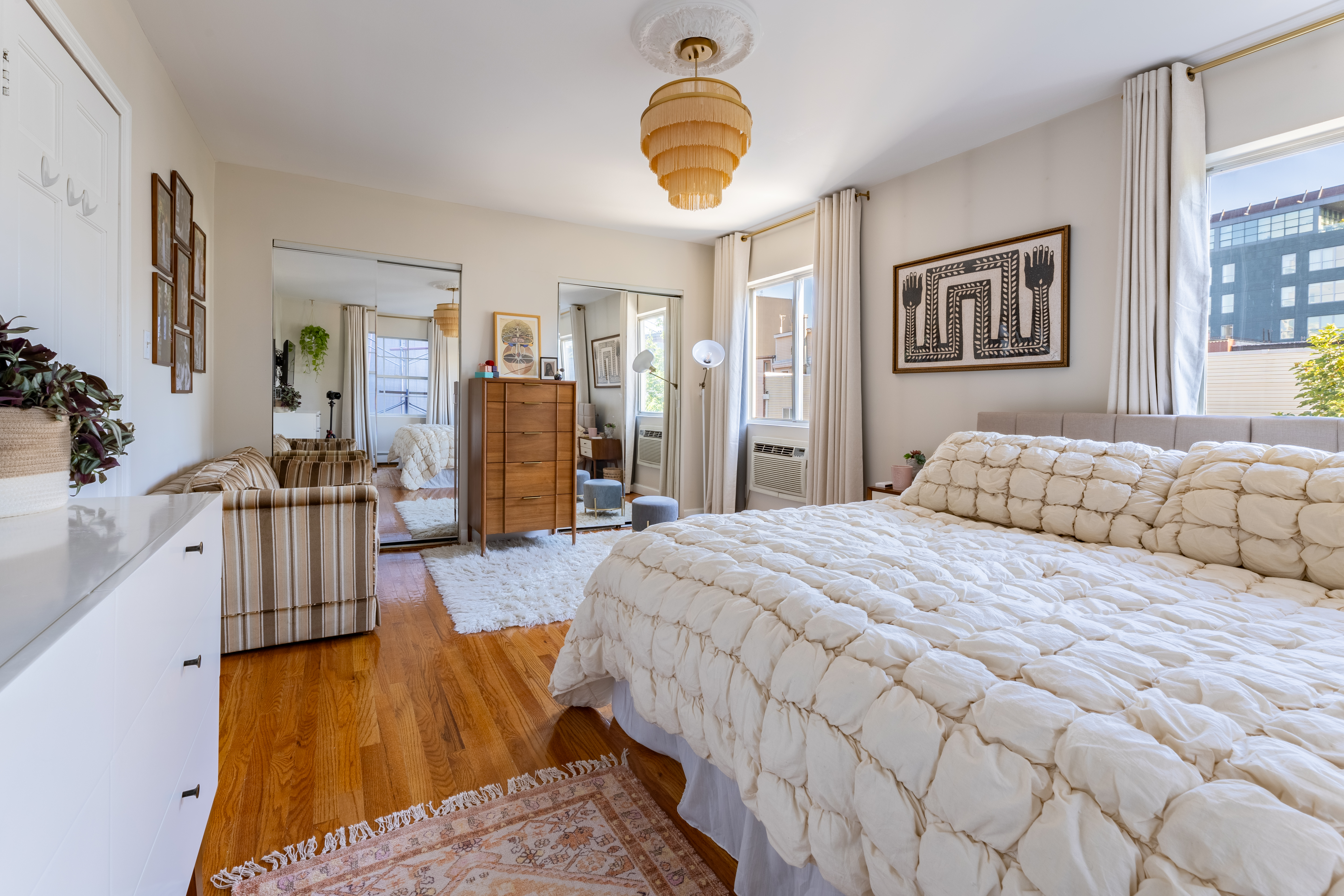 80 South 3rd Street, Unit 2 Brooklyn, NY 11249 - Photo 9 of 15 a bedroom with a bed a couch and dresser