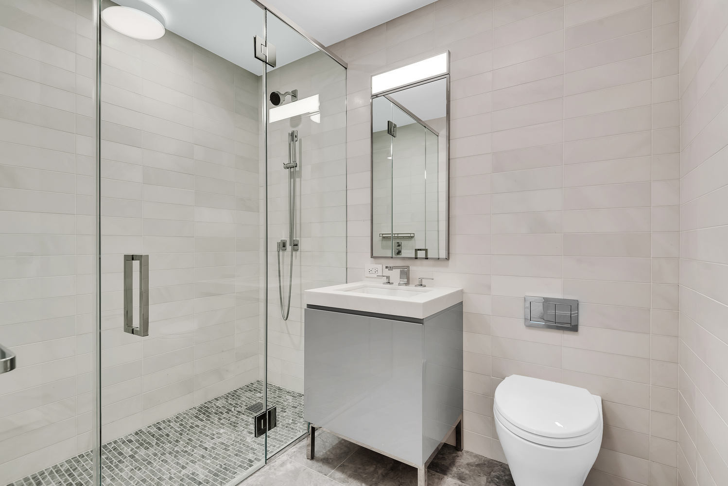 50 West 66th Street, Unit 7B Manhattan, NY 10023 - Photo 16 of 24 a bathroom with a toilet sink and mirror