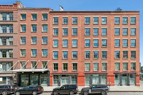 a front view of a building with lot of windows