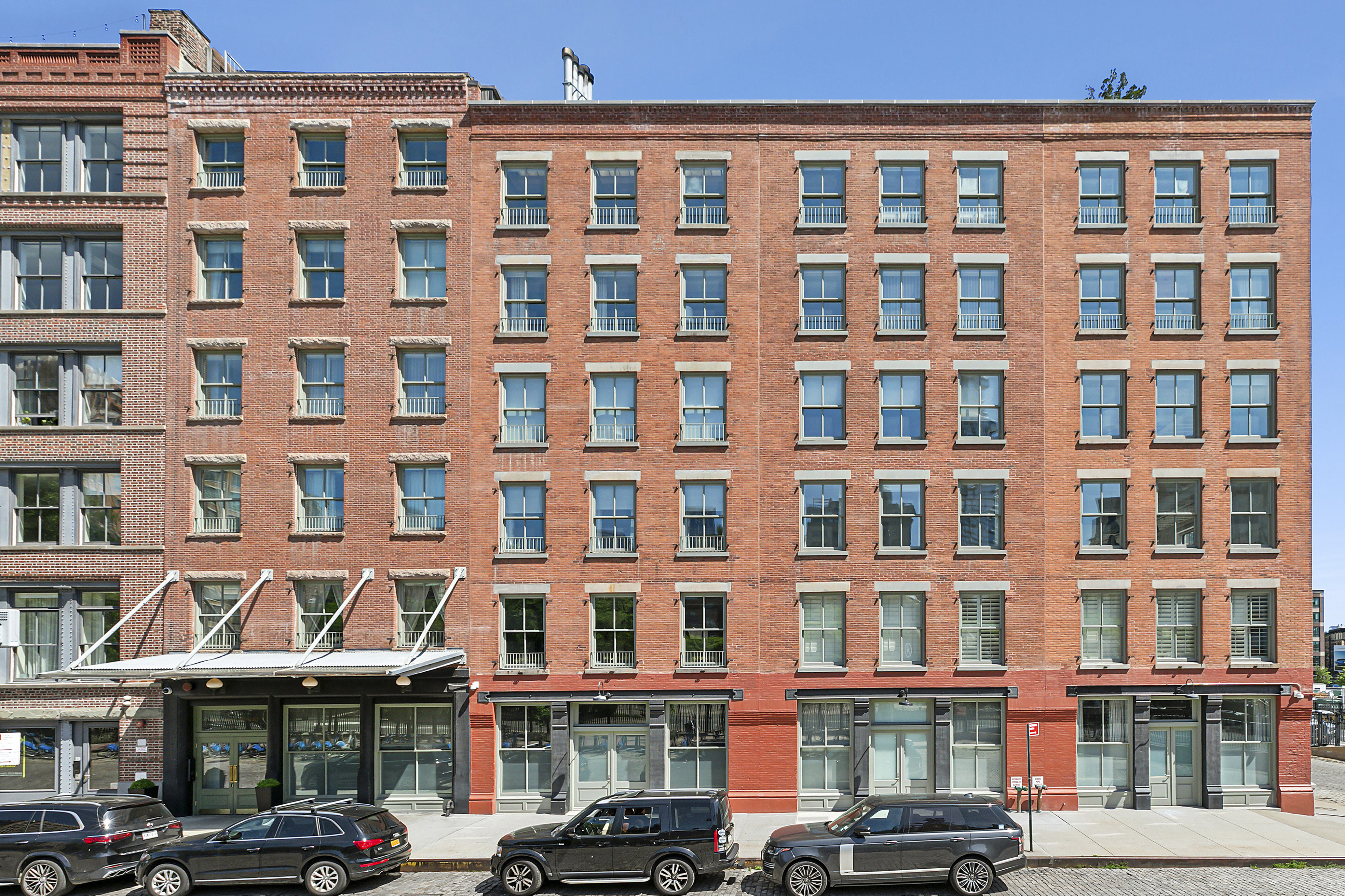 28 Laight Street, Unit 3B Manhattan, NY 10013 - Photo 9 of 11 a front view of a building with lot of windows