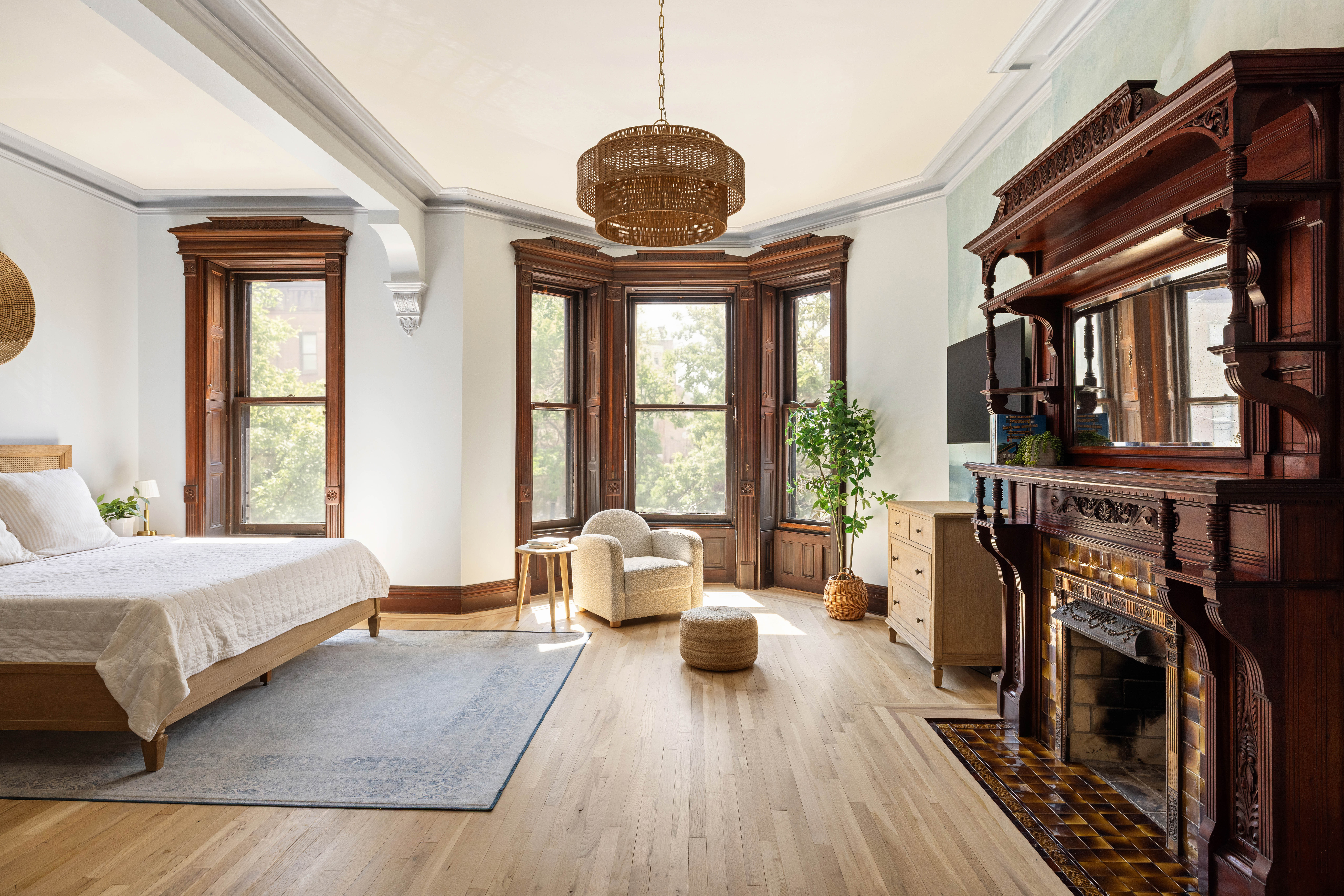 787 Carroll Street Brooklyn, NY 11215 - Photo 13 of 32 a living room with furniture a window and a chandelier