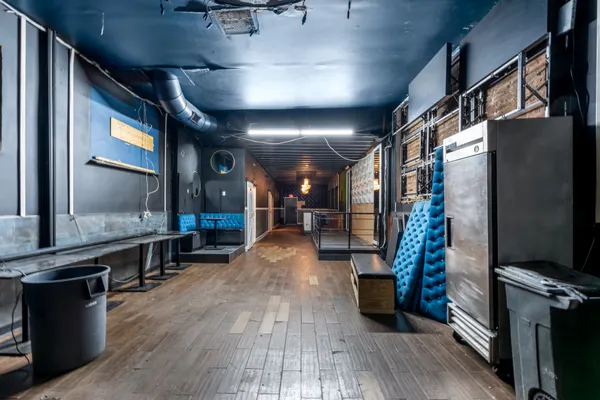 a lobby with furniture and a flat screen tv