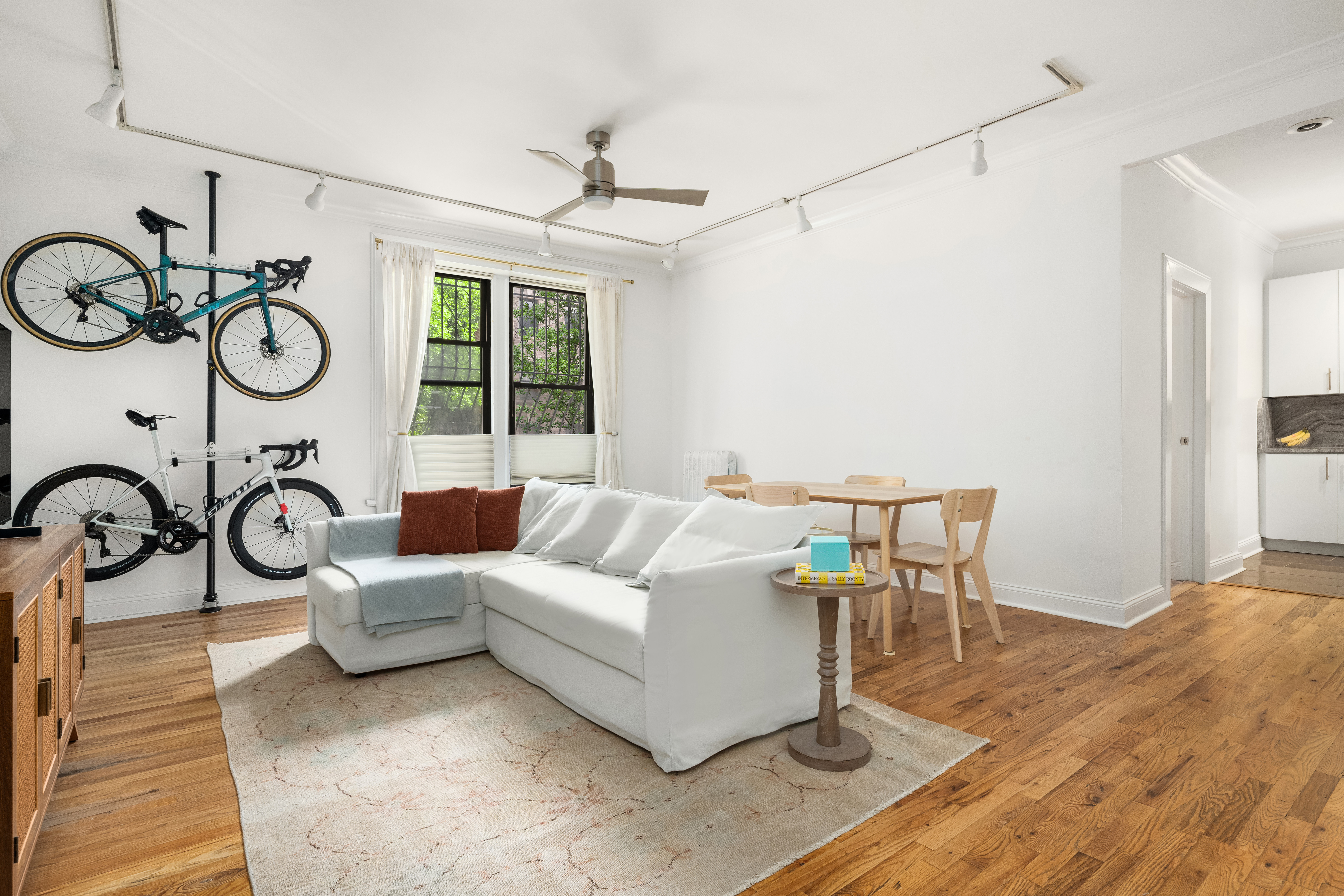 a living room with a large window and a table