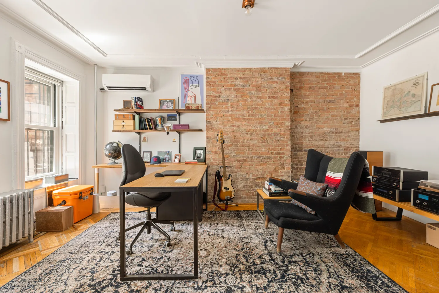 a living room with furniture fireplace and rug