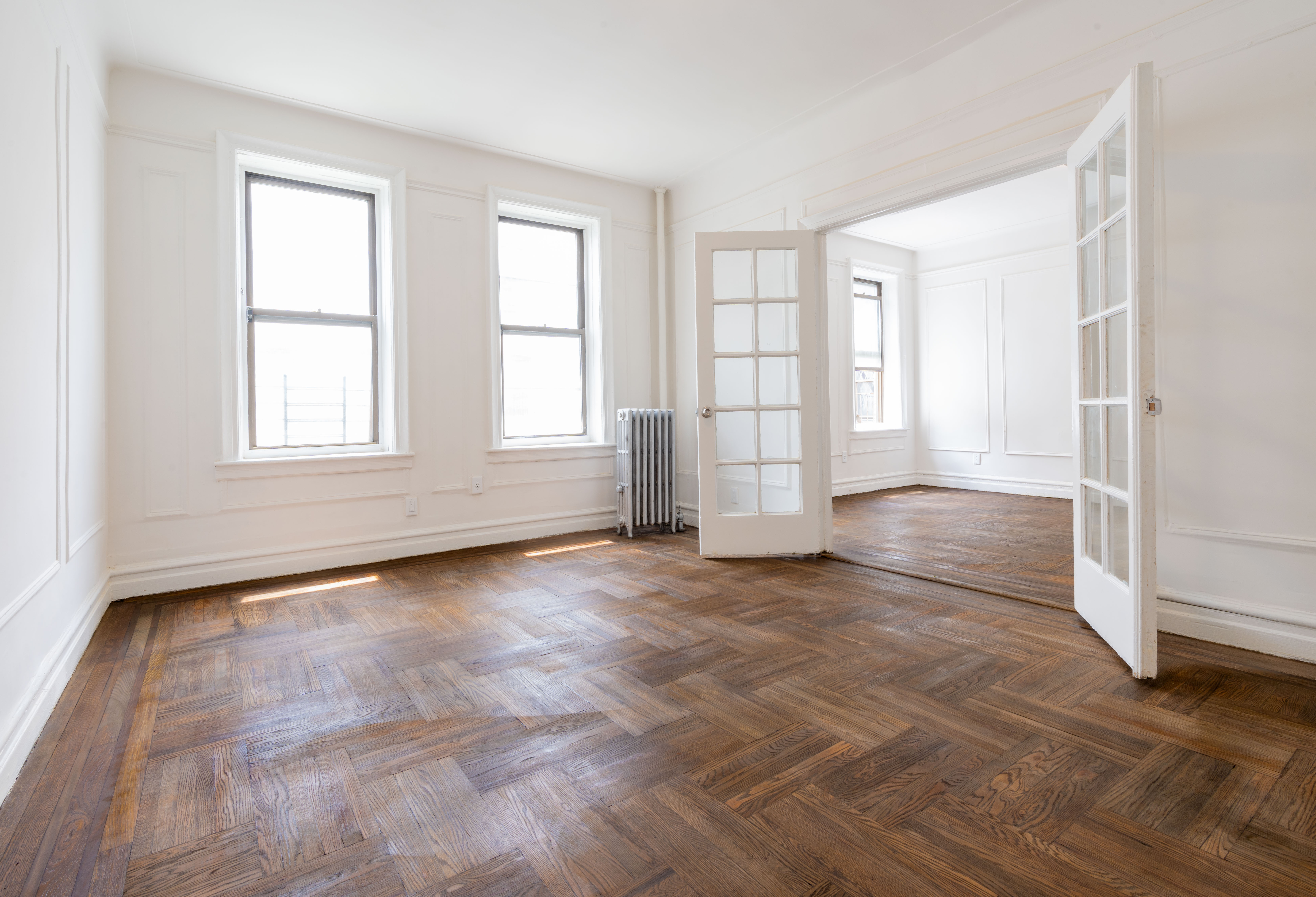 1405 Prospect Place, Unit B11 Brooklyn, NY 11213 - Photo 6 of 12 an empty room with wooden floor and windows
