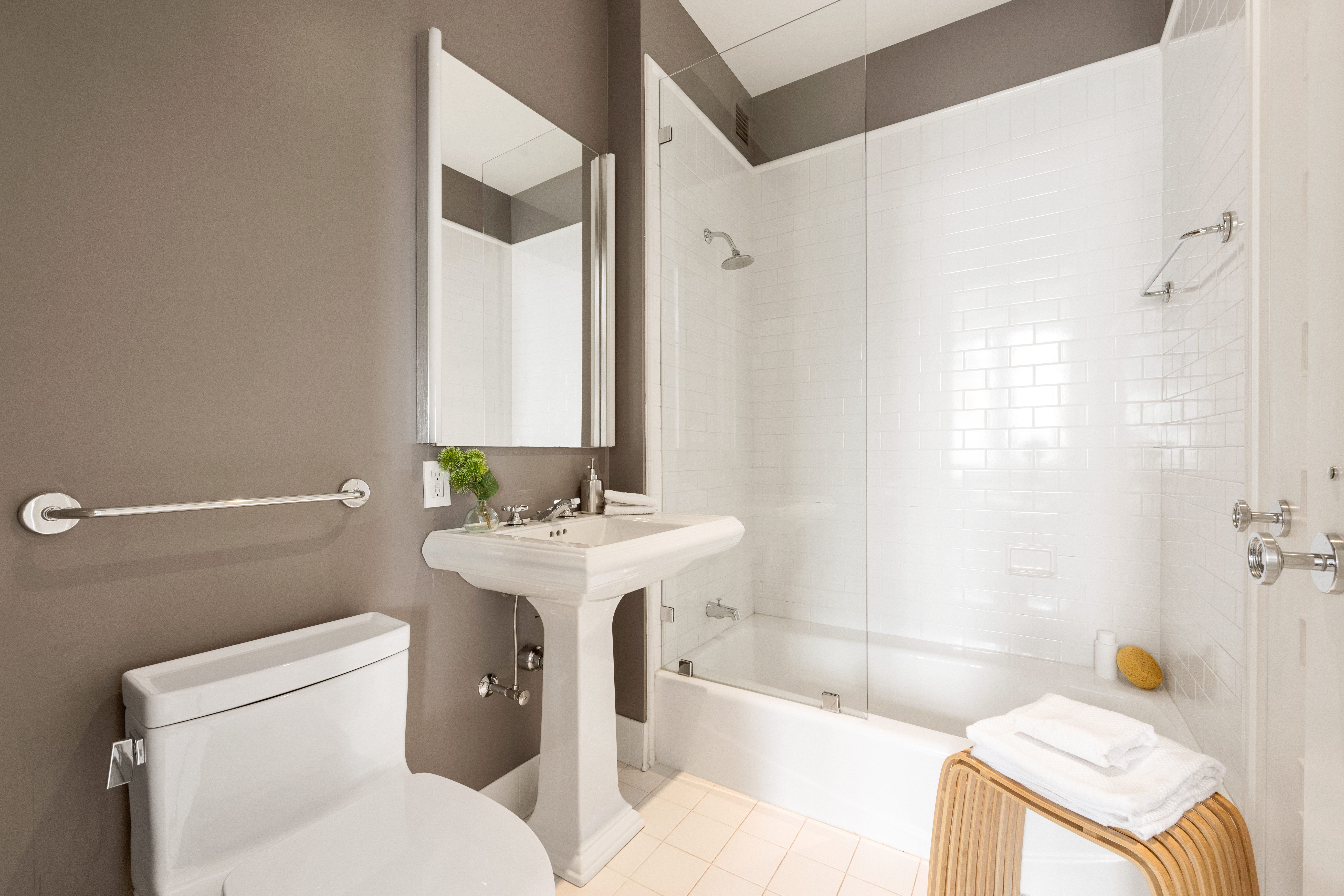 252 7th Avenue, Unit 17I Manhattan, NY 10001 - Photo 16 of 17 a bathroom with a sink toilet and shower