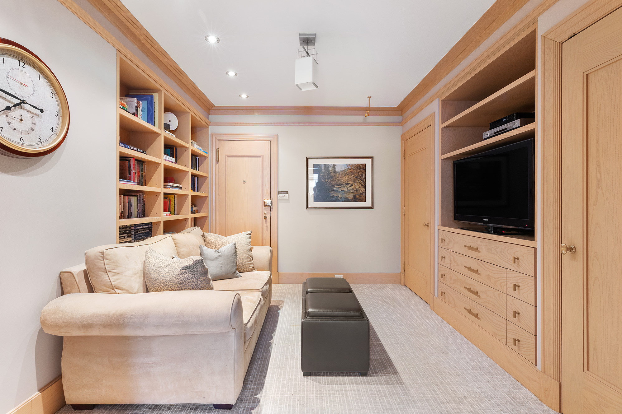 360 East 72nd Street, Unit C1801 Manhattan, NY 10021 - Photo 15 of 20 a living room with furniture a flat screen tv and a window