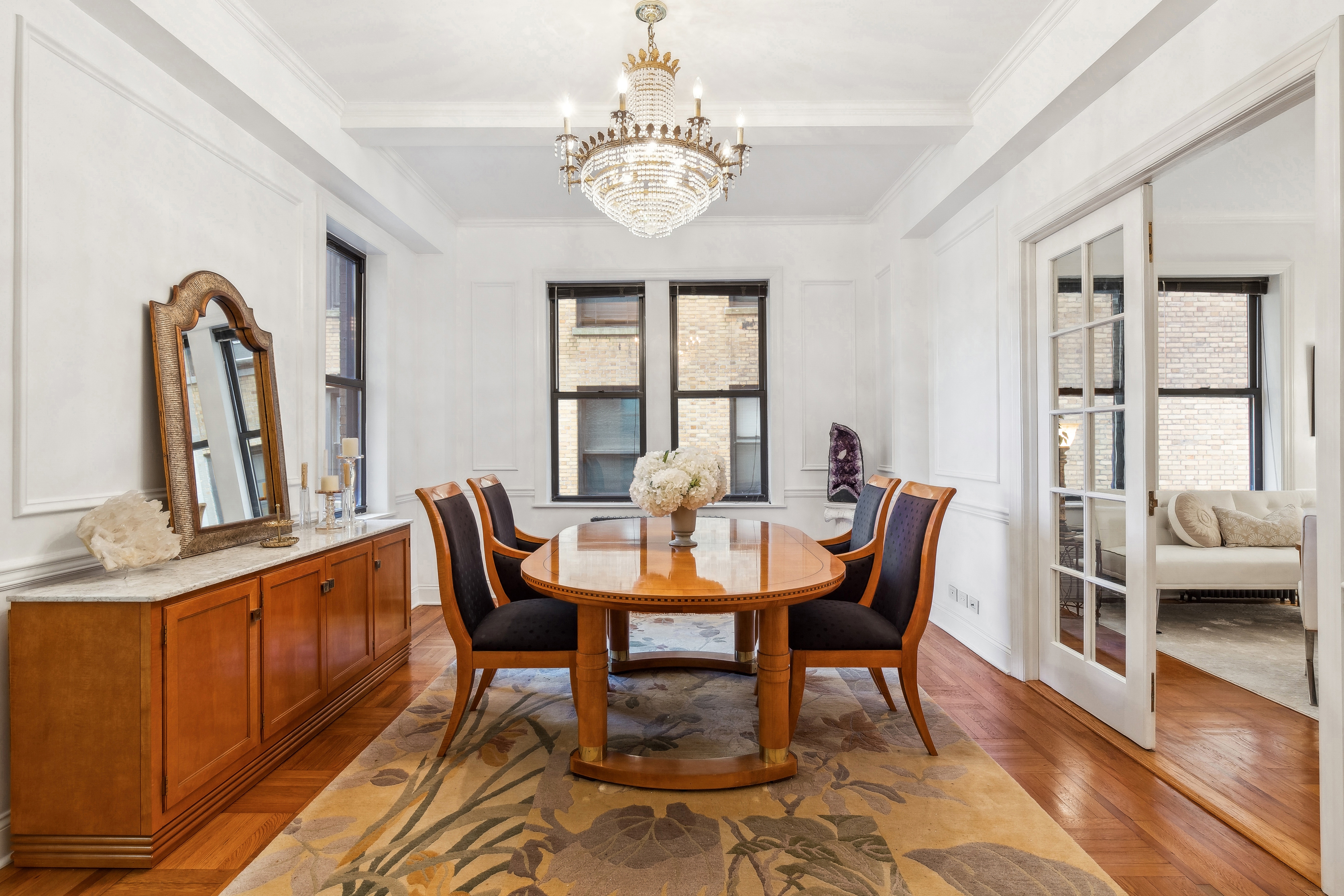 300 Riverside Drive, Unit 5E Manhattan, NY 10025 - Photo 3 of 11 a view of a dining room with furniture window and wooden floor
