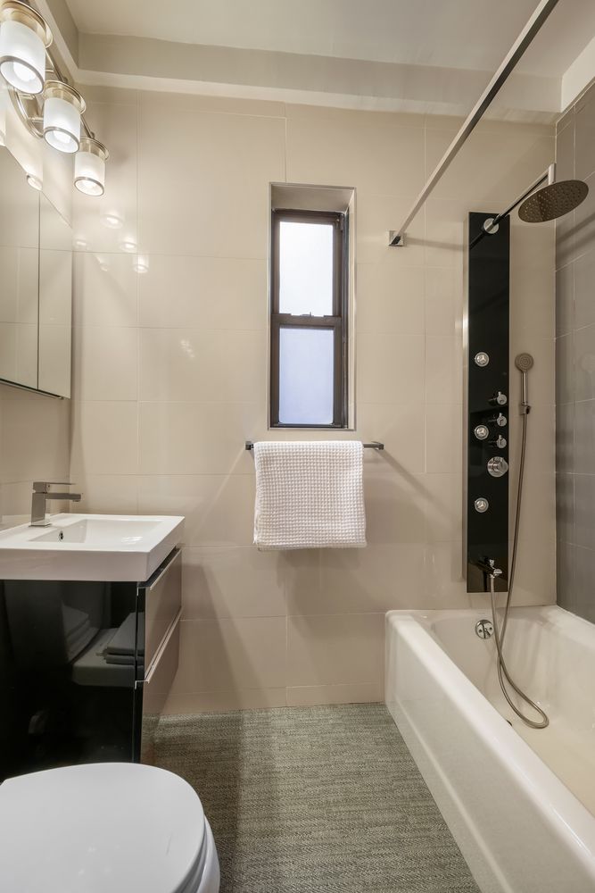 20 West 84th Street, Unit 3A Manhattan, NY 10024 - Photo 2 of 5 a bathroom with a sink a toilet and bathtub