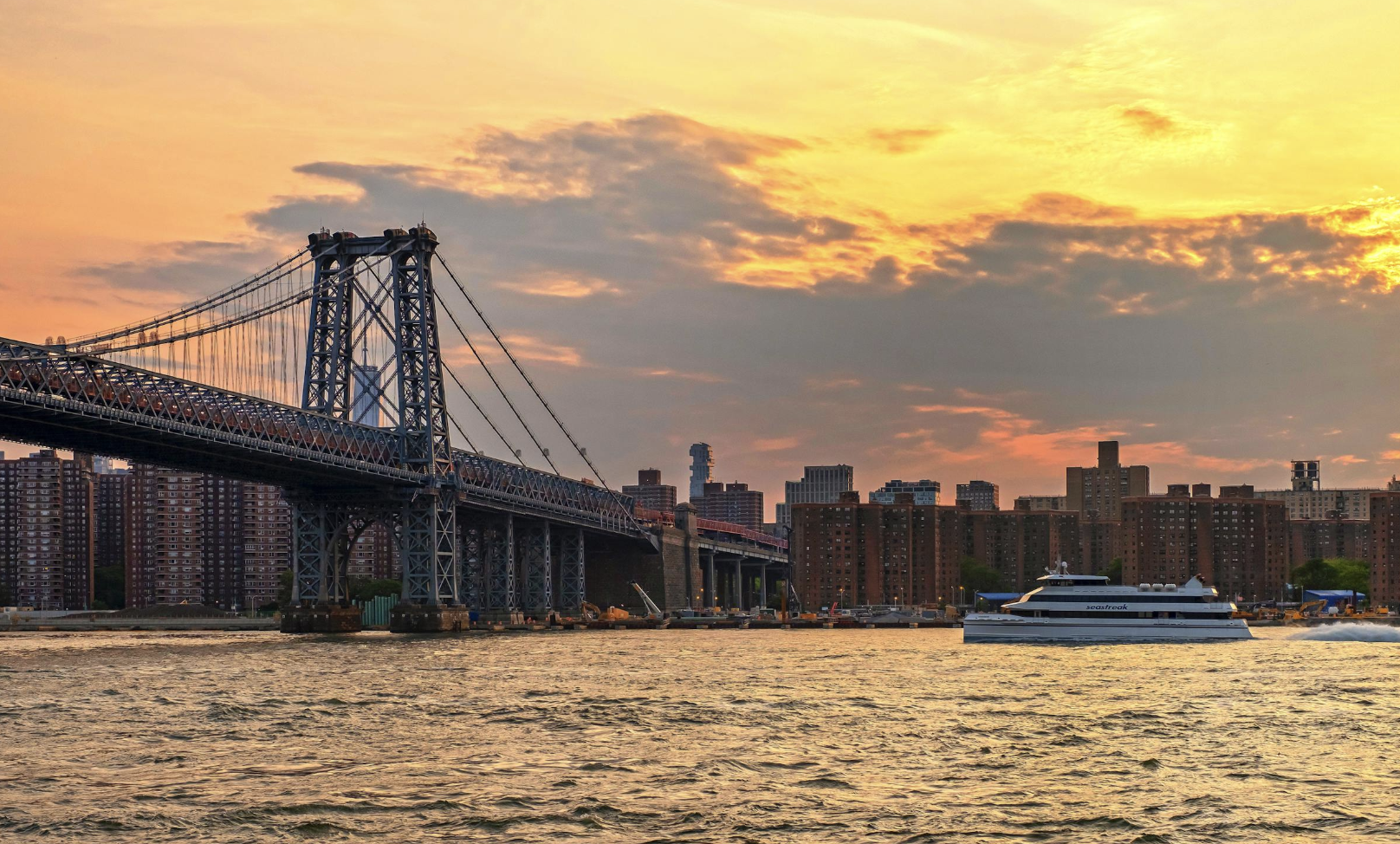 184 Kent Avenue, Unit B407 Brooklyn, NY 11249 - Photo 7 of 14 a view of a house with wooden bridge