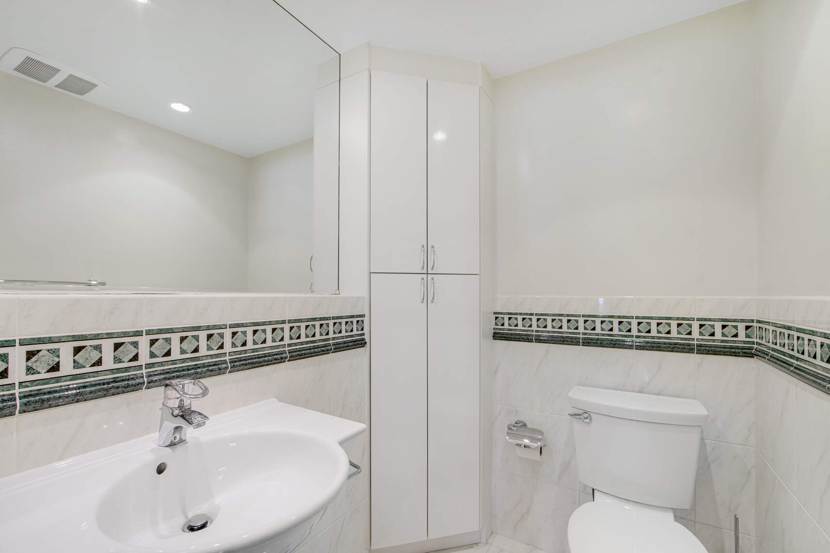 150 West 56th Street, Unit 3812 Manhattan, NY 10019 - Photo 9 of 14 a bathroom with a sink a toilet and shower