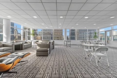 a view of roof deck with patio