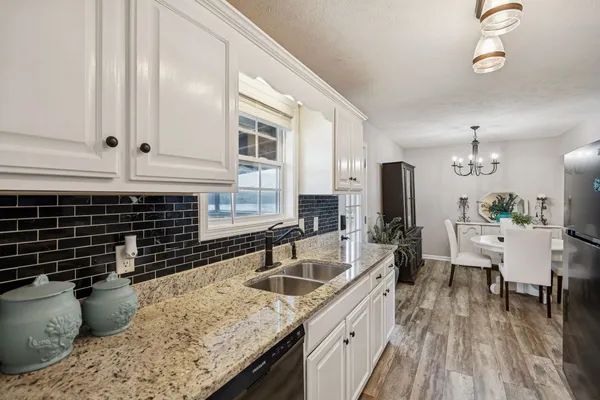 a kitchen with a sink and cabinets