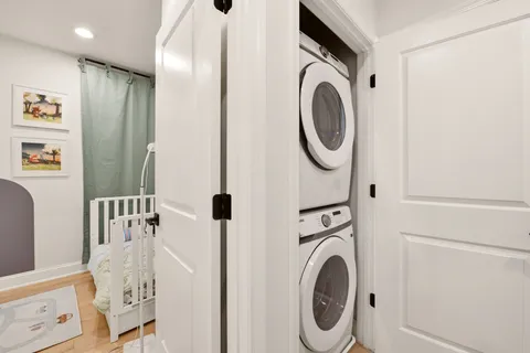 a bathroom with a sink a washer and dryer