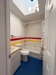a bathroom with a bathtub and a sink