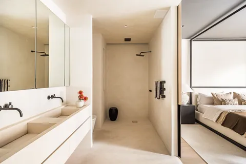 a bathroom with a tub shower and sink