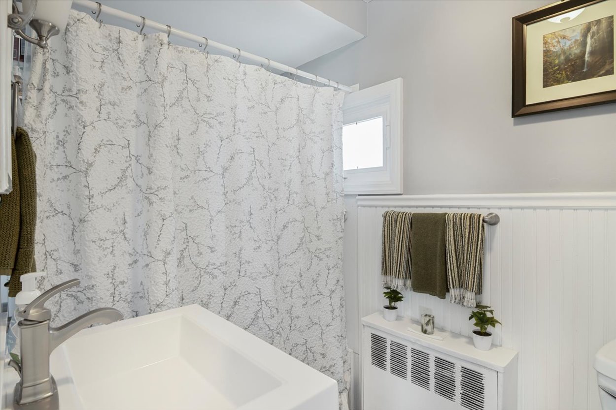 107 Kingston Road Parsippany, NJ 07054 - Photo 23 of 43 a bathroom with a sink and a mirror