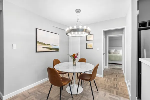 a view of a dining room with furniture and wooden floor