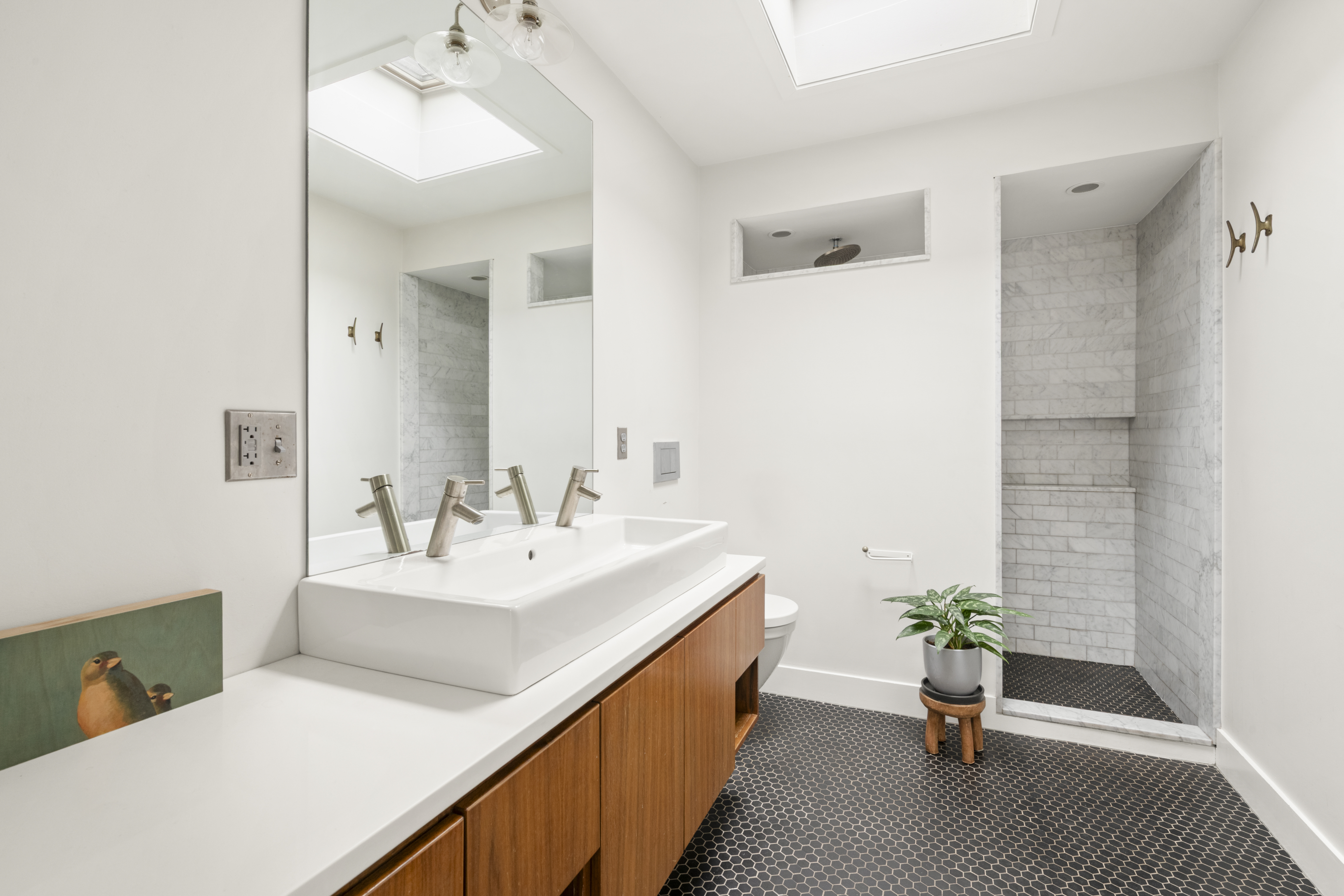 203 Huntington Street Brooklyn, NY 11231 - Photo 9 of 16 a en suite bathroom with a double vanity sink and a mirror