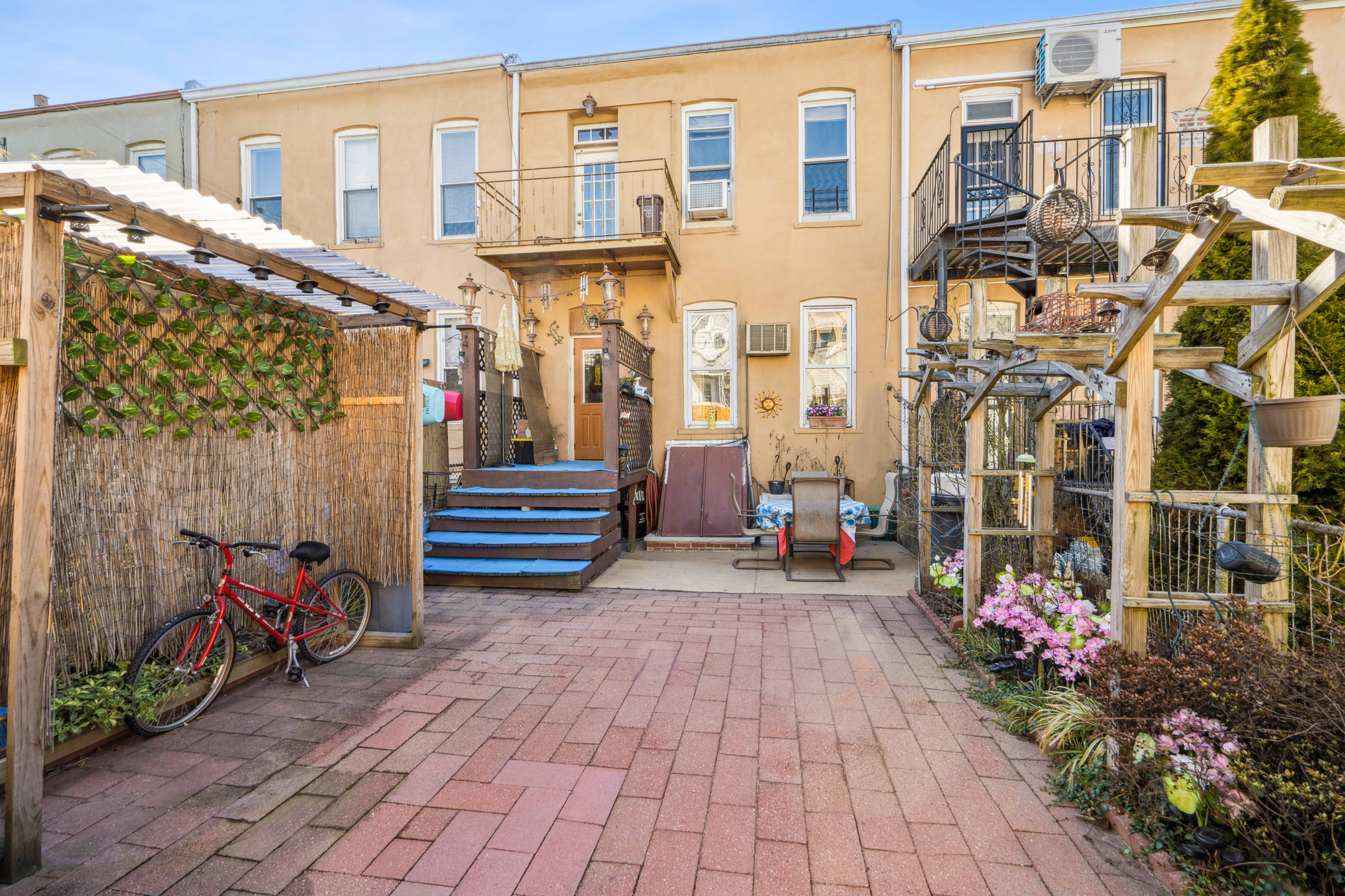 75-27 61st Street Queens, NY 11385 - Photo 9 of 10 a view of a building with sitting area