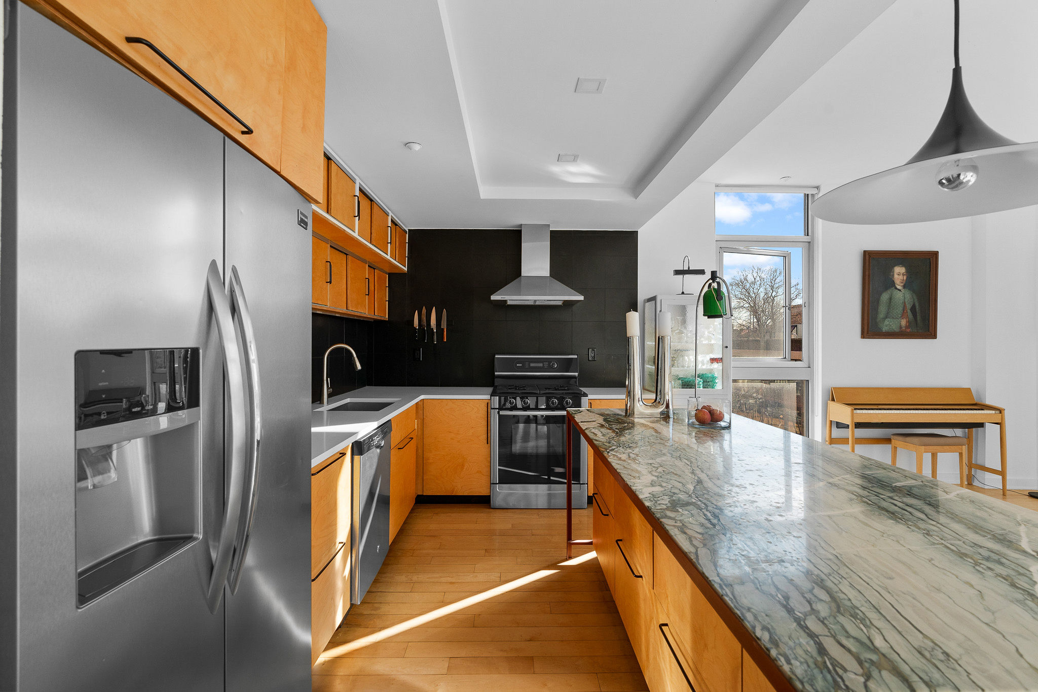 82 Guernsey Street, Unit 3B Brooklyn, NY 11222 - Photo 4 of 18 a kitchen with stainless steel appliances granite countertop a sink a stove and a refrigerator