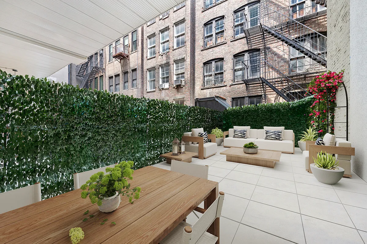 35 East 10th Street, Unit 2G Manhattan, NY 10003 - Photo 1 of 11 a view of a building in the backyard