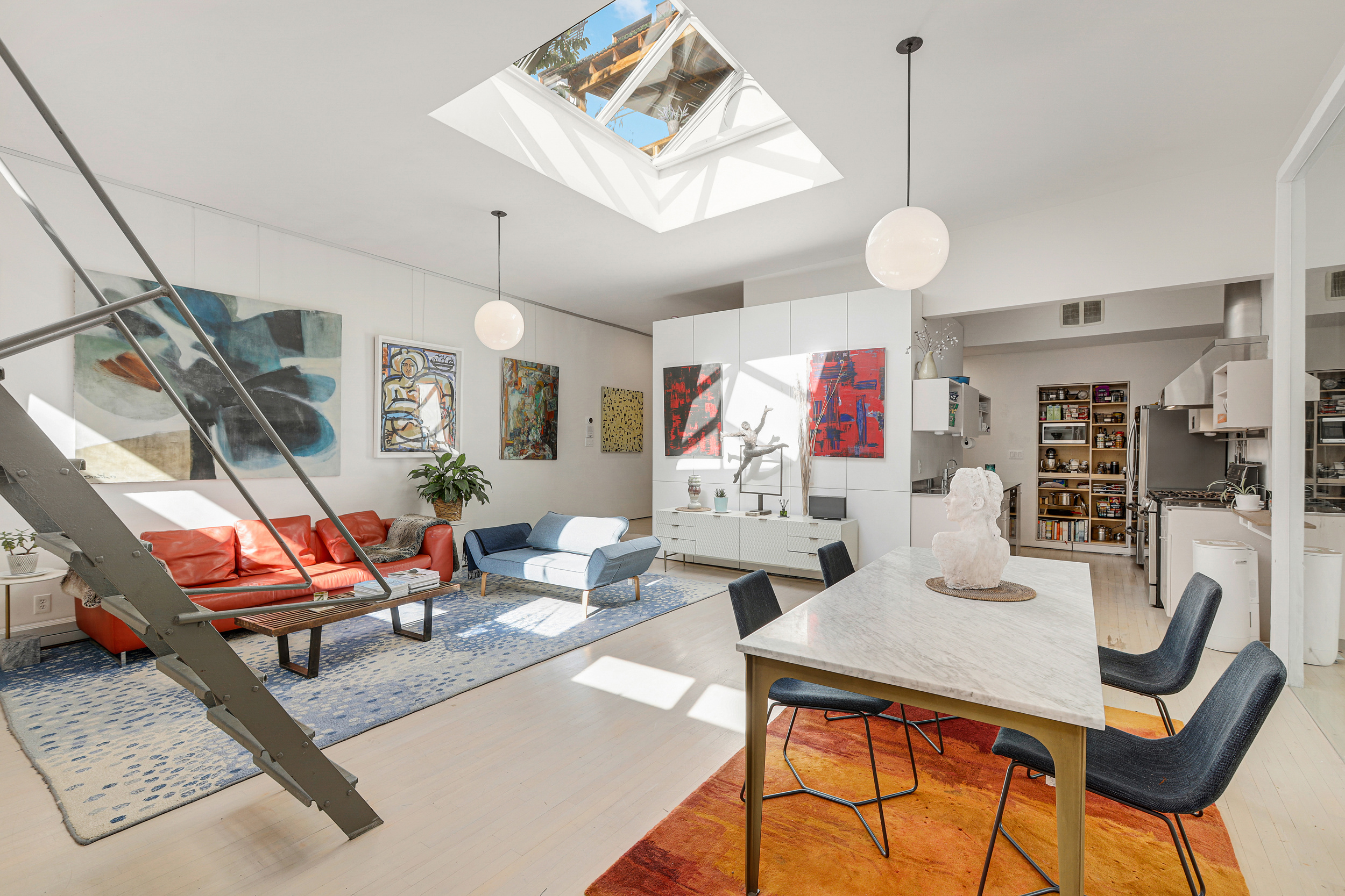 56 Bergen Street, Unit 1R Brooklyn, NY 11201 - Photo 3 of 13 a living room with lots of furniture and a chandelier