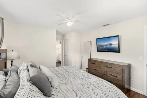 a bathroom with a bathtub and a hallway