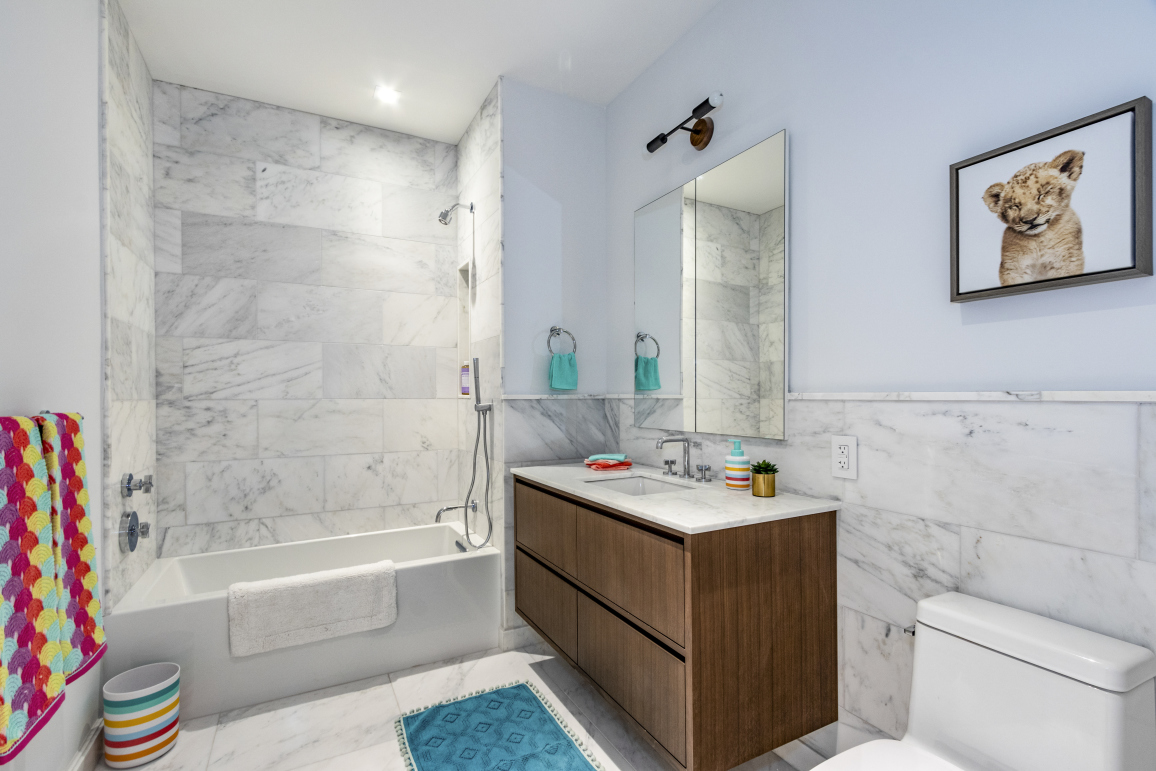 106 Franklin Street, Unit PH Manhattan, NY 10013 - Photo 7 of 13 a bathroom with a sink mirror toilet and bathtub