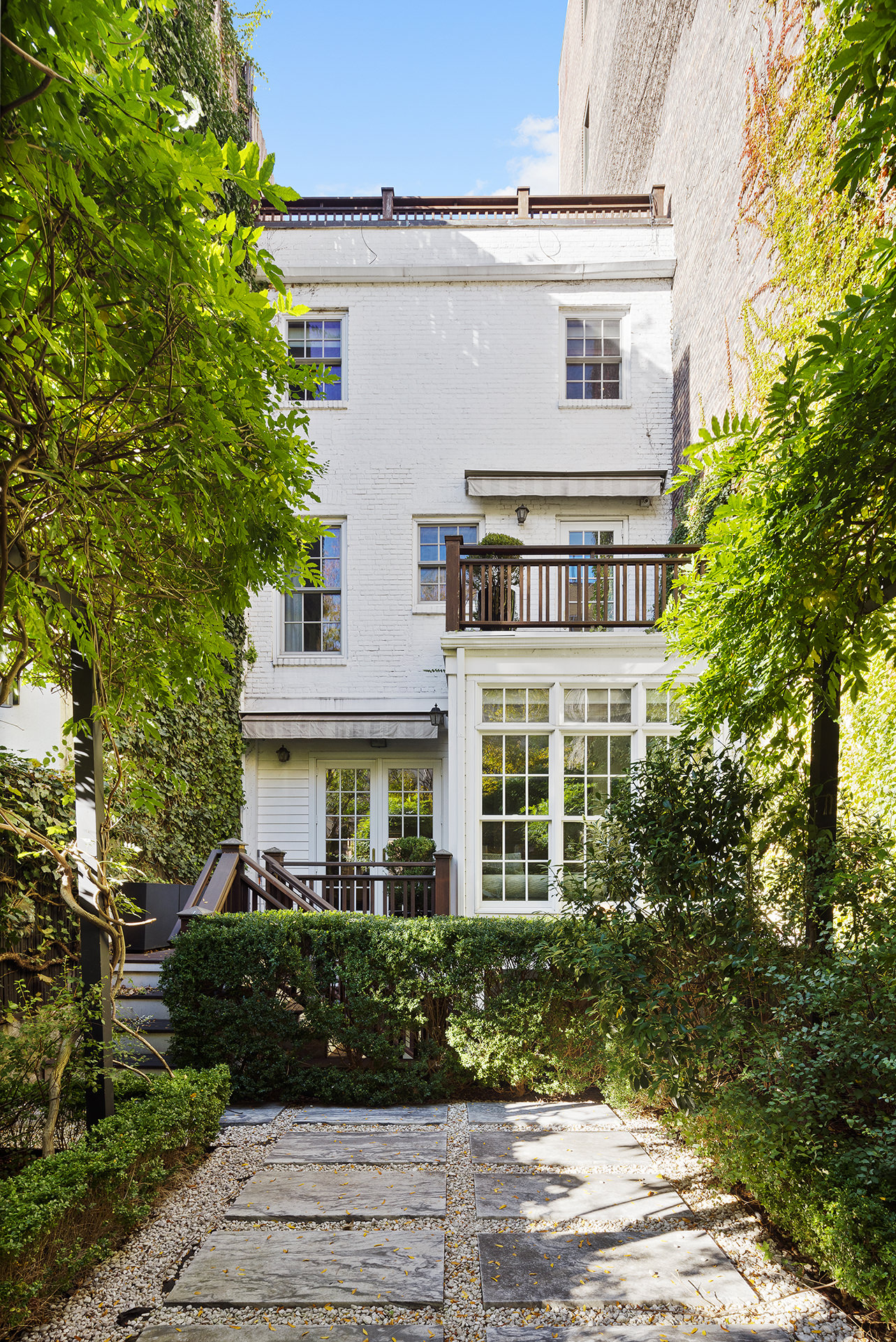 12 Leroy Street Manhattan, NY 10014 - Photo 6 of 20 a front view of a house with a yard