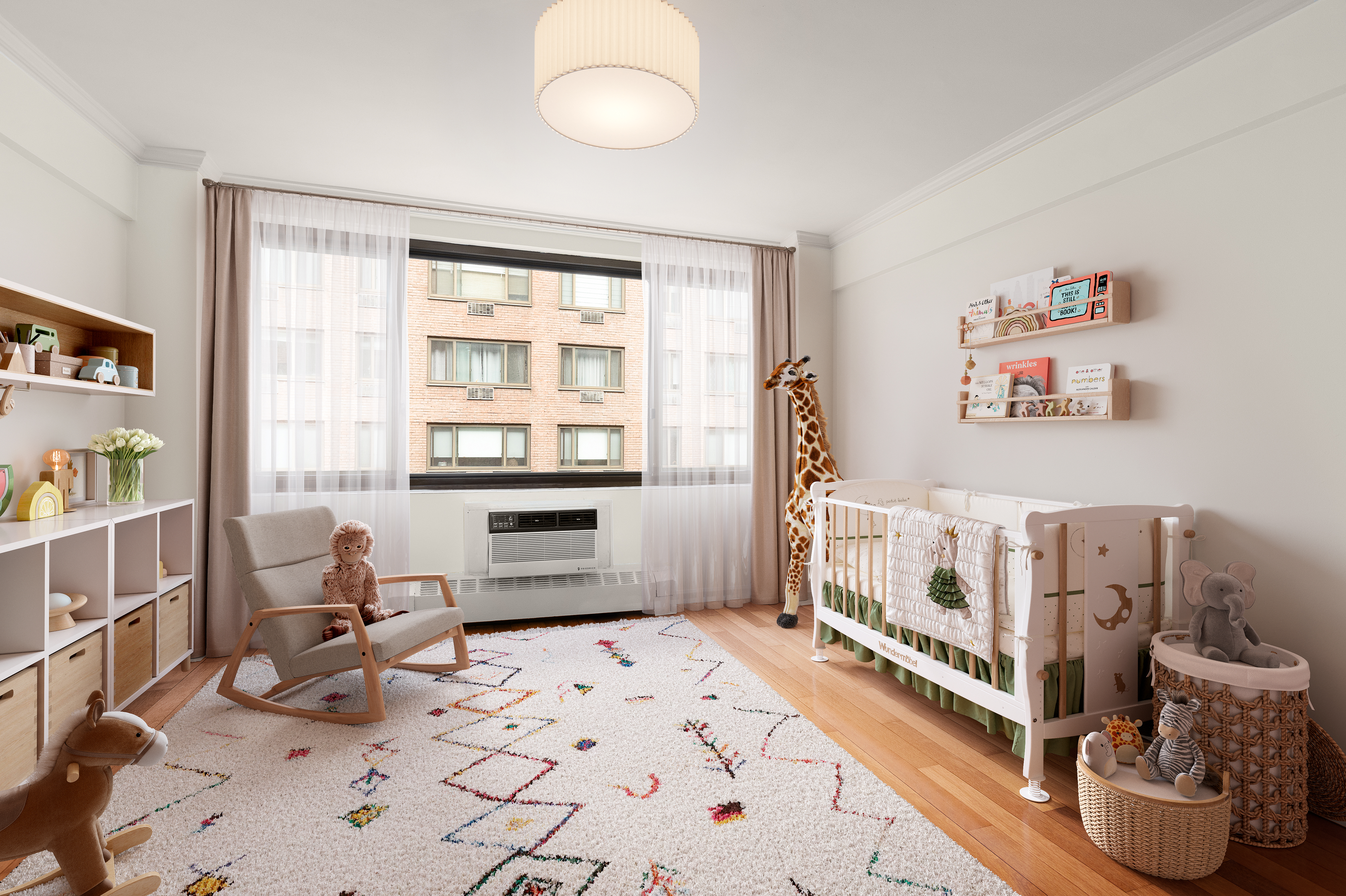 425 East 63rd Street, Unit E7A Manhattan, NY 10065 - Photo 2 of 13 a living room with furniture and a large window