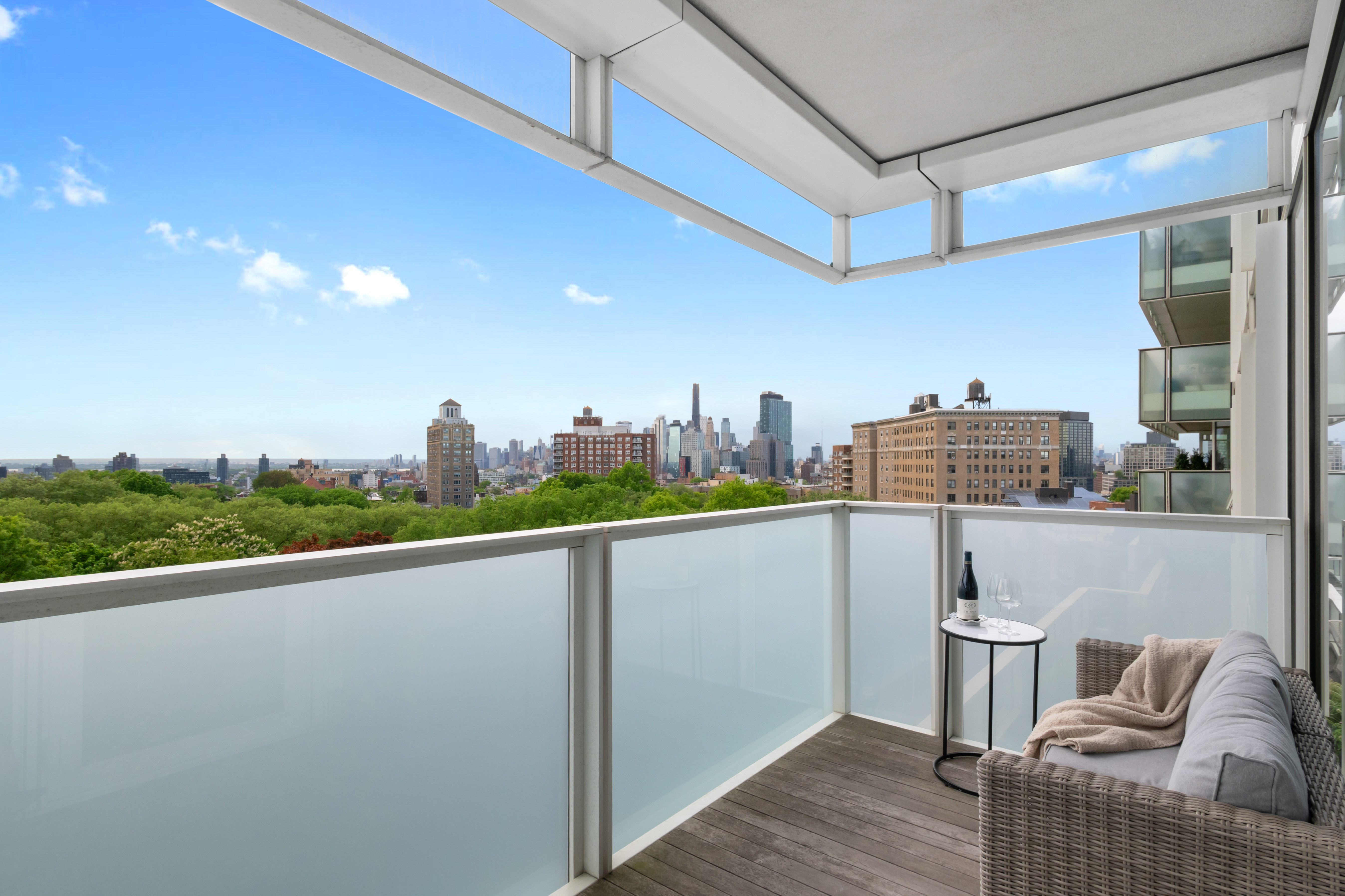 1 Grand Army Plaza, Unit 9D Brooklyn, NY 11238 - Photo 2 of 20 a view of roof deck with dining table and chairs