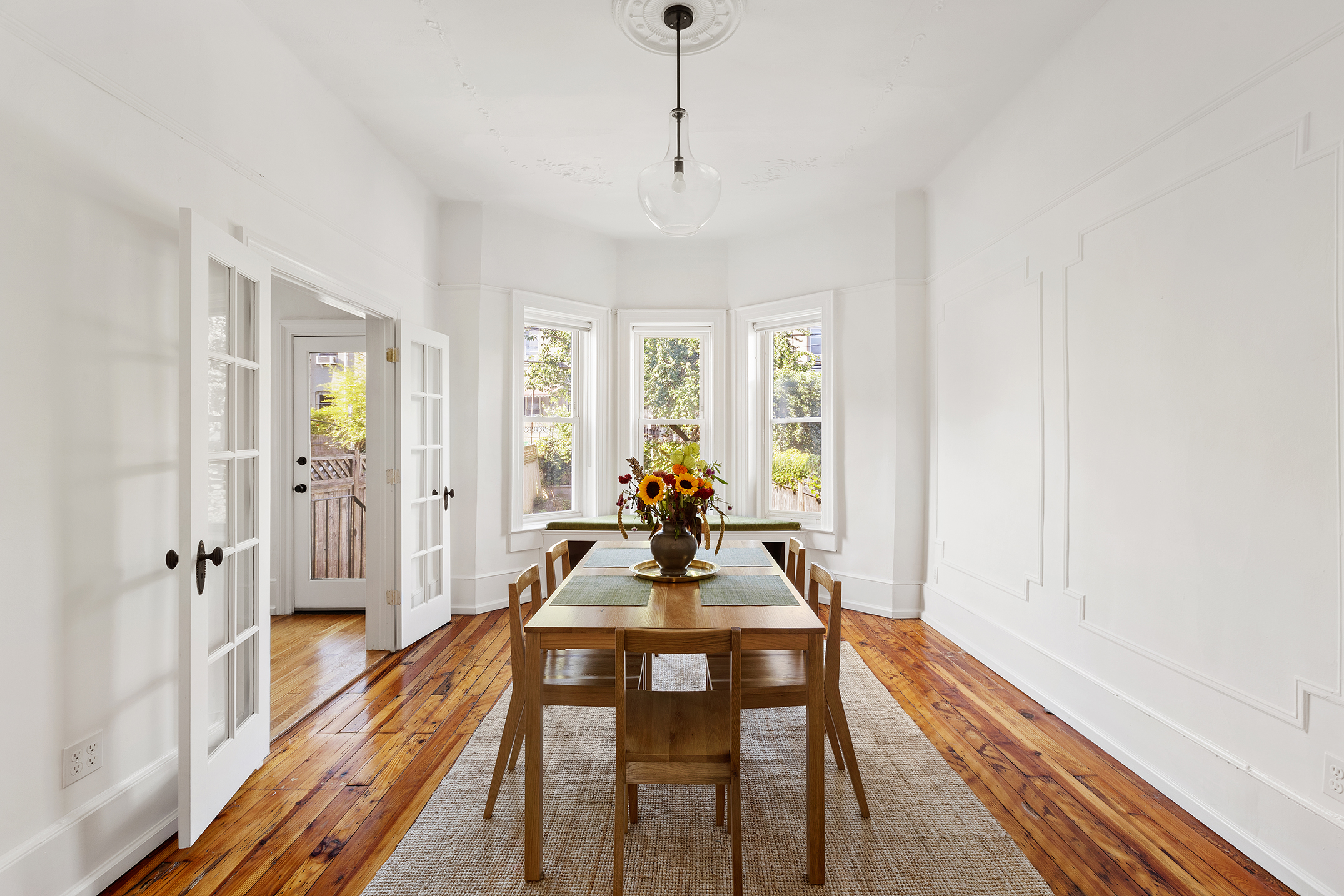 195 Lefferts Avenue Brooklyn, NY 11225 - Photo 4 of 18 a view of a dining room with furniture window and wooden floor
