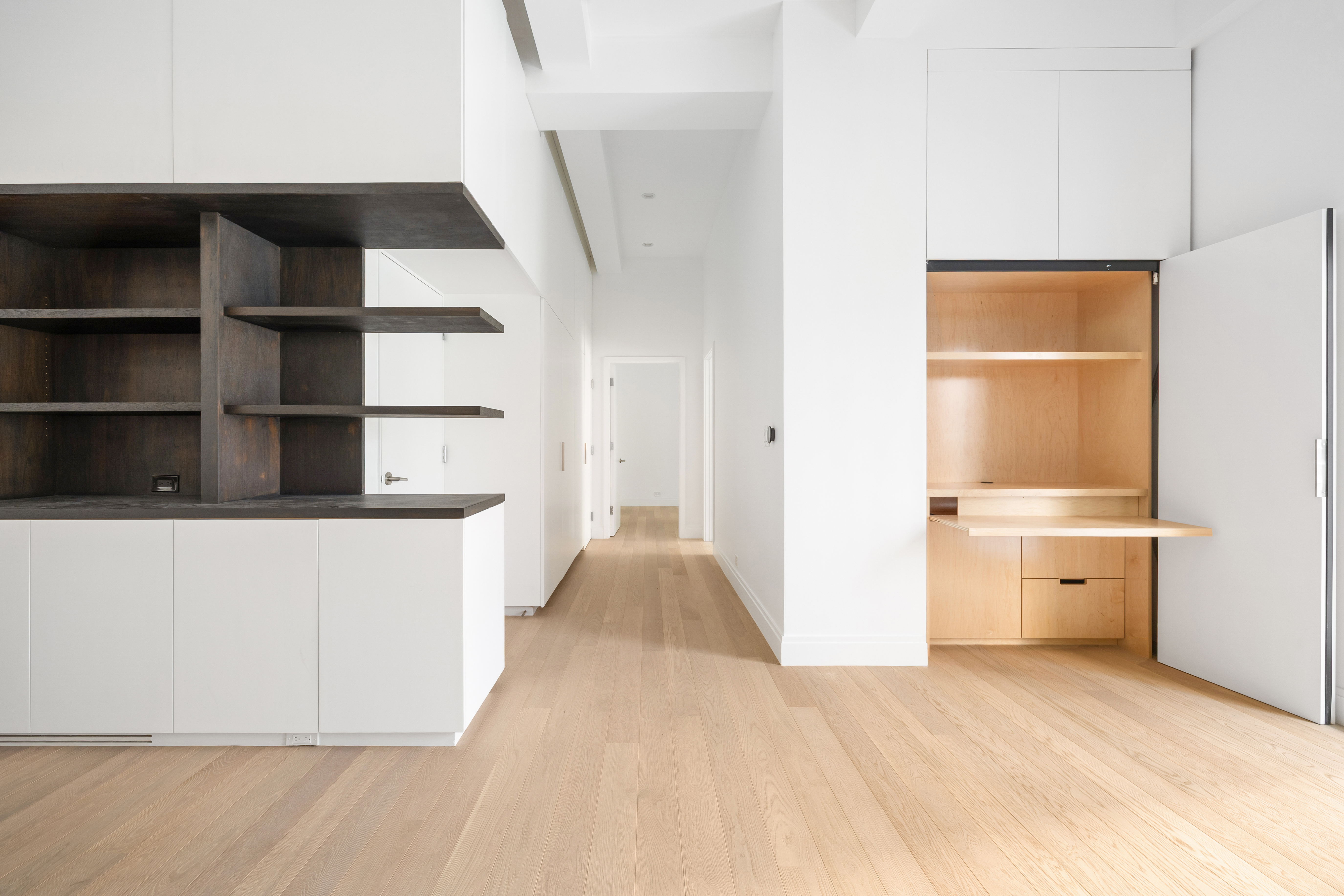 69 Bank Street, Unit 203 Manhattan, NY 10014 - Photo 10 of 23 a view of walk in closet with empty racks