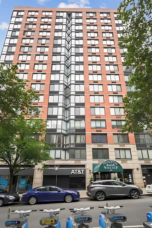 215 West 95th Street, Unit 9J Manhattan, NY 10025 - Photo 9 of 11 front view of a building with a street