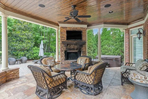 a dining room with furniture and a fireplace