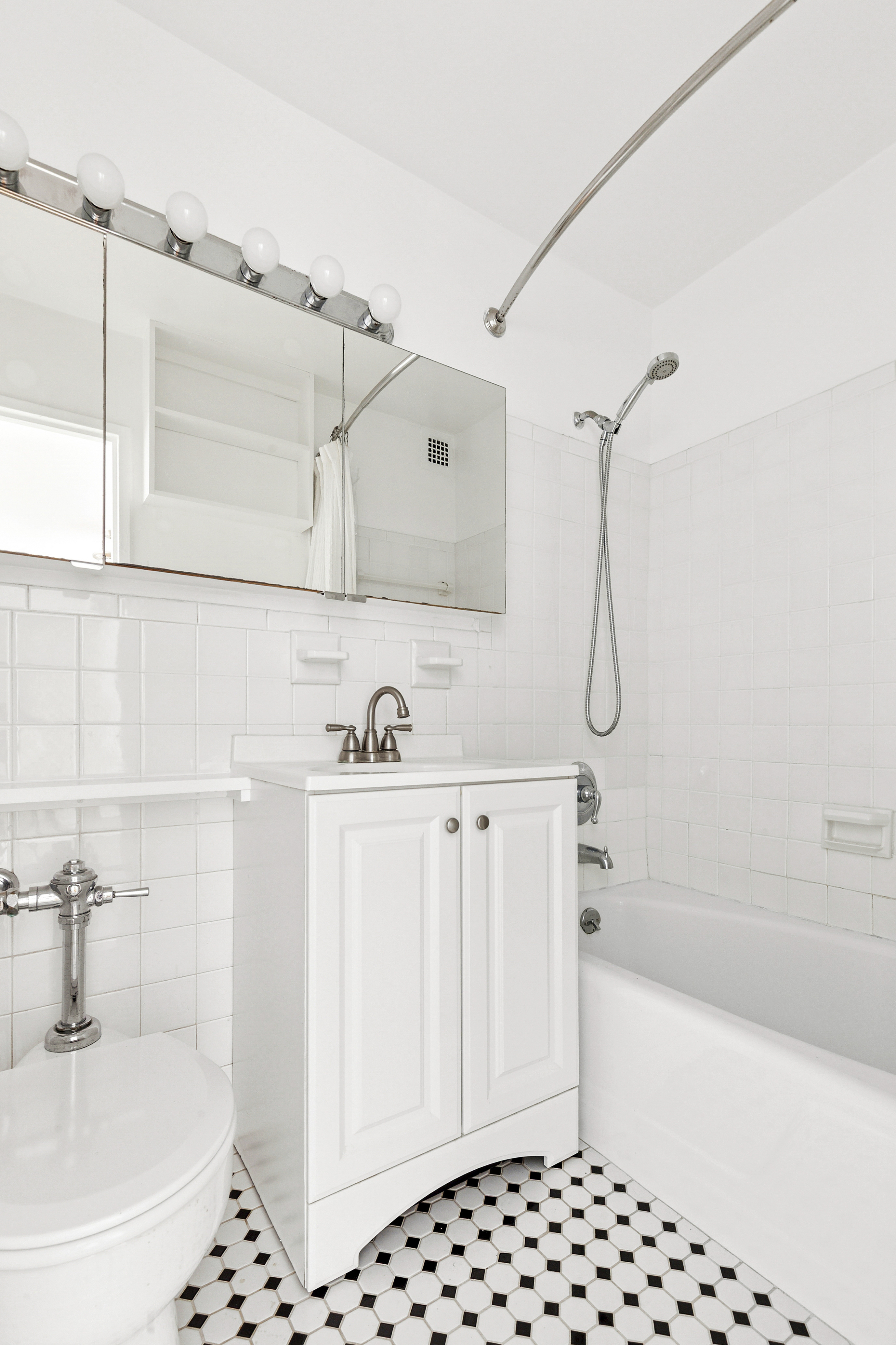 201 East 36th Street, Unit 5D Manhattan, NY 10016 - Photo 7 of 9 a bathroom with a bathtub and shower
