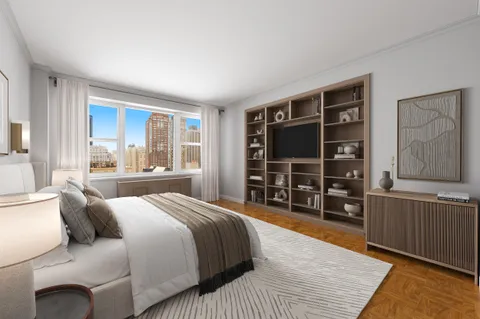 a bedroom with a bed a table and chair